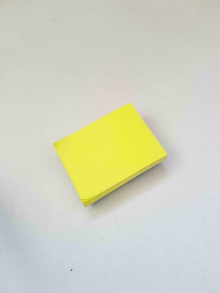 Isolated white photo of a yellow sticky note. These sticky notes look floating.