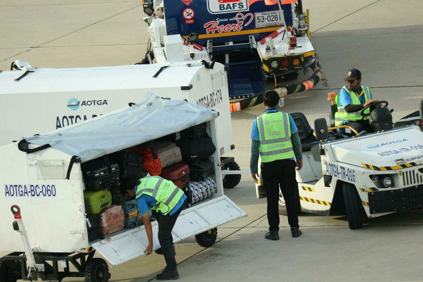 Bangkok, Thailand on July 9, 2023. Loading process into the Unit Load Device of AOTGA at Don mueang International Airport. photo