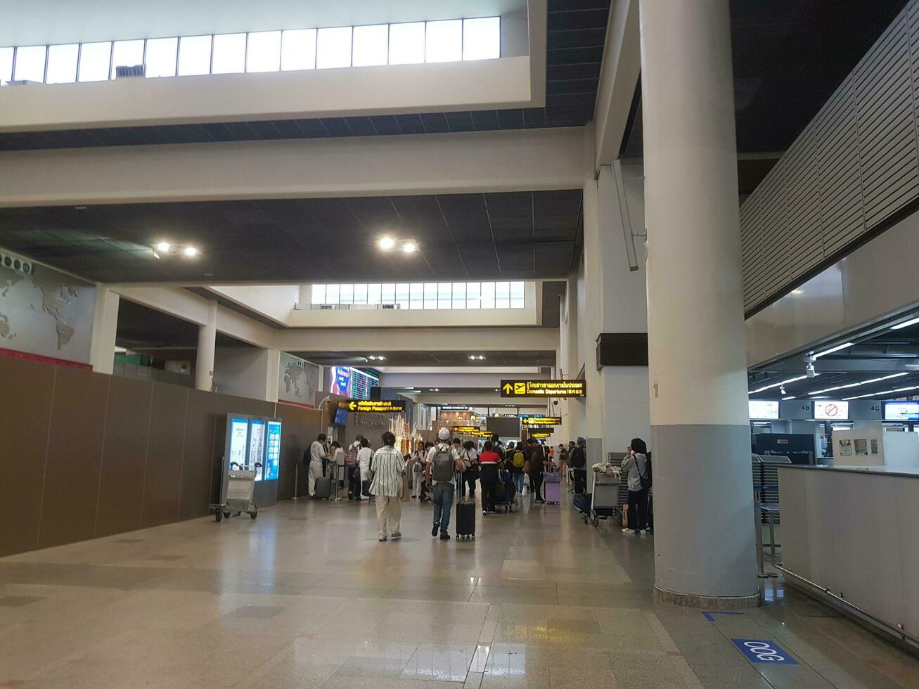 Bangkok, Thailand on July 9, 2023. Several people are lining up to check foreign passports to enter immigration counter. photo
