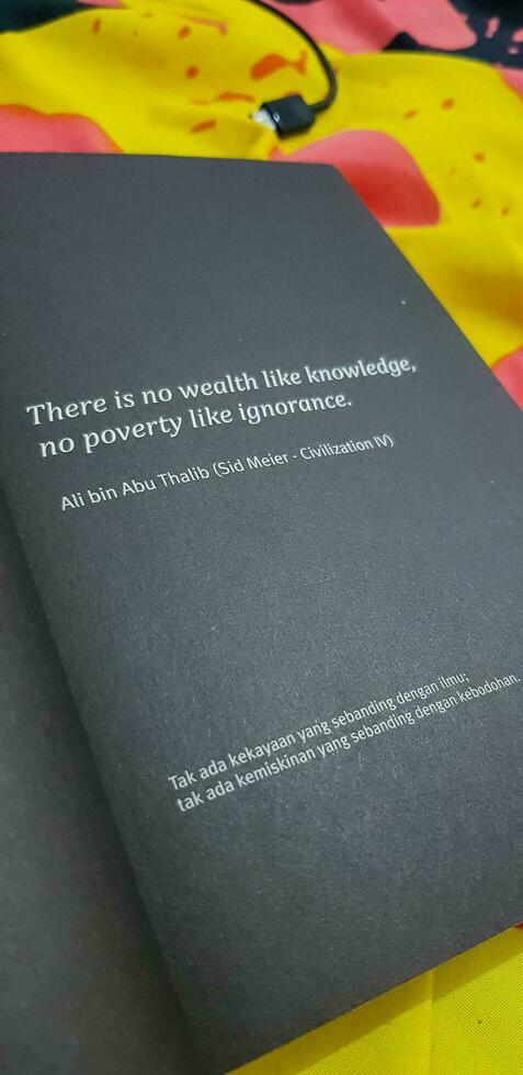 Ali bin Abu Talib's quote reads, There is no wealth like knowledge, no poverty like ignorance. photo