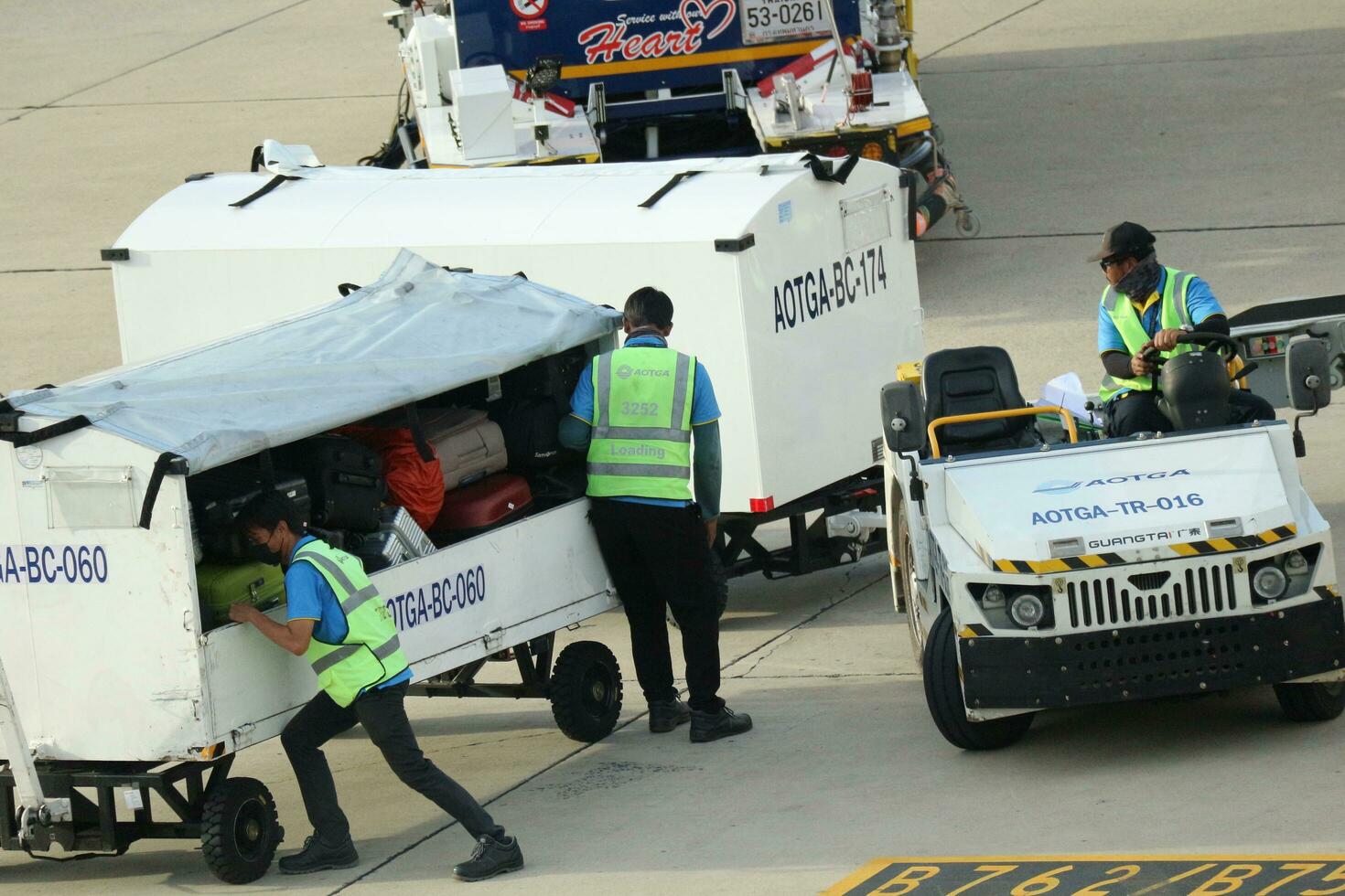Bangkok, Thailand on July 9, 2023. Loading process into the Unit Load Device of AOTGA at Don mueang International Airport. photo