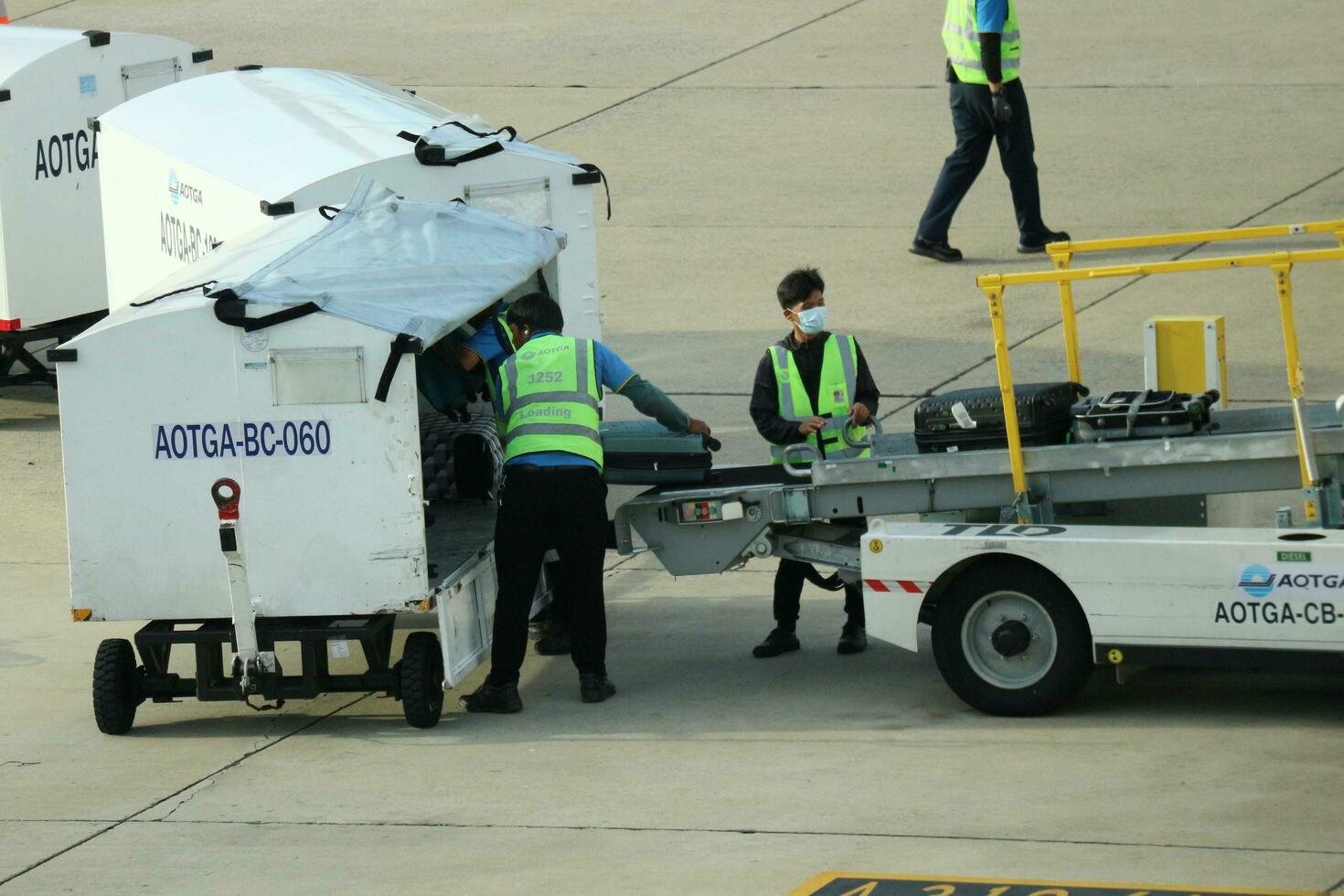 Bangkok, Thailand on July 9, 2023. Loading process into the Unit Load Device of AOTGA at Don mueang International Airport. photo