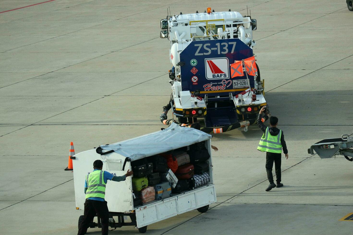 Bangkok, Thailand on July 9, 2023. Loading process into the Unit Load Device of AOTGA at Don mueang International Airport. photo