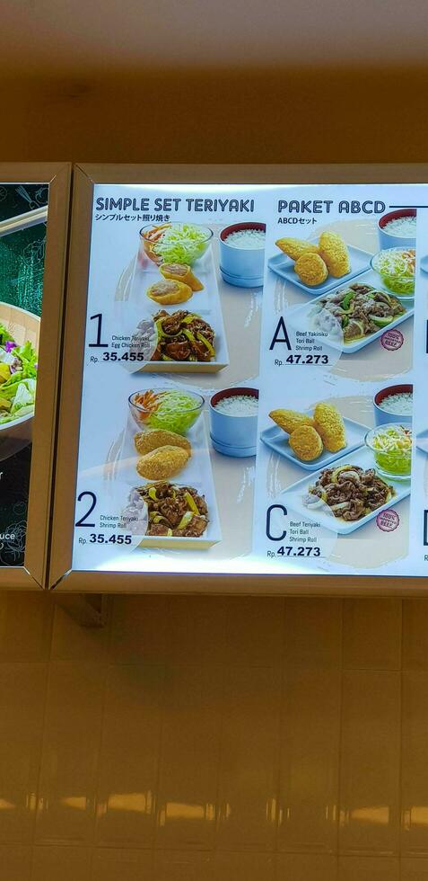 Bekasi, Indonesia in May 2018. One of the favorite menus at Hoka-Hoka Bento. Simple teriyaki set and ABCD Package. photo