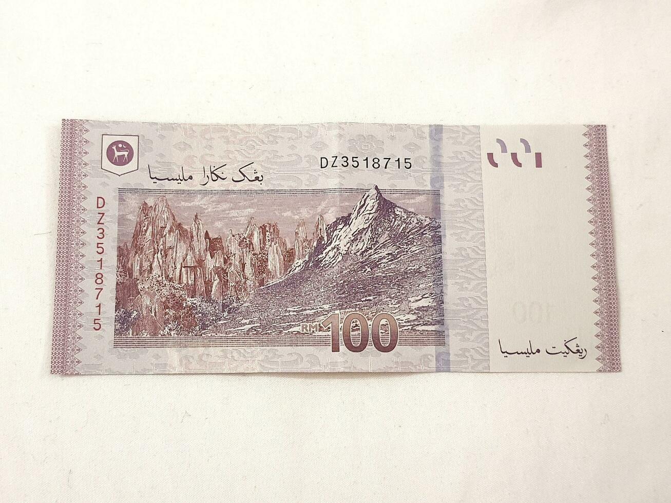 Isolated white photo of one piece of 100 ringgit malaysian bank notes