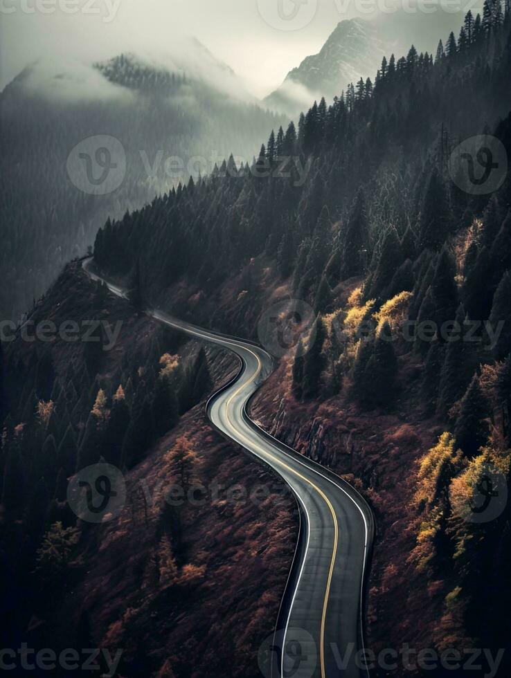Dark misty day with empty Winding mountain road. Created with Generative AI technology. photo