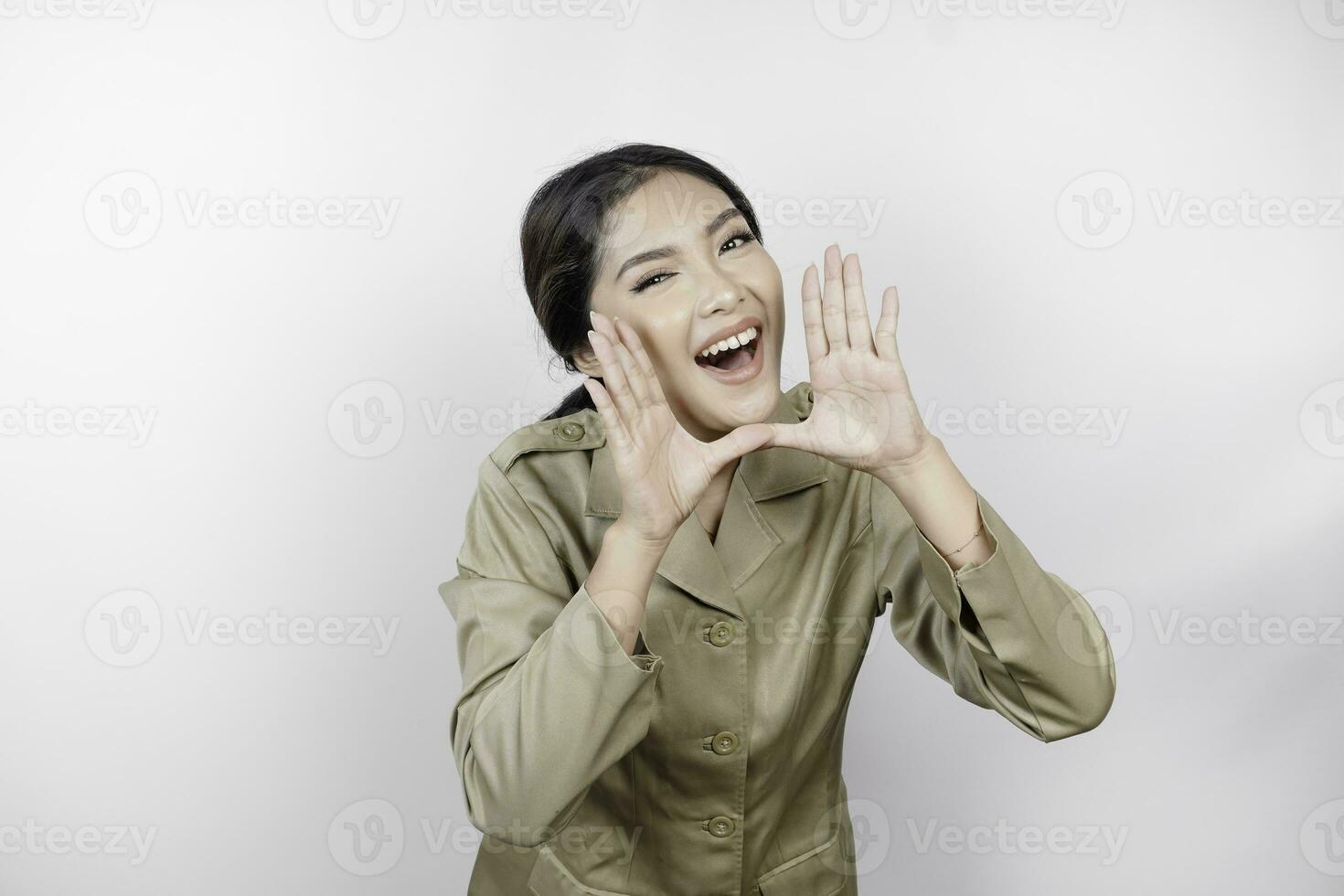 Young beautiful civil worker woman is shouting or yelling isolated by a white background. Communication concept photo