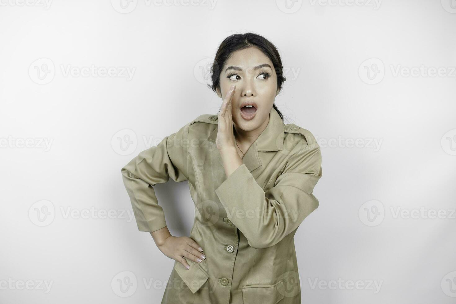 Young beautiful civil worker woman is shouting or yelling isolated by a white background. Communication concept photo