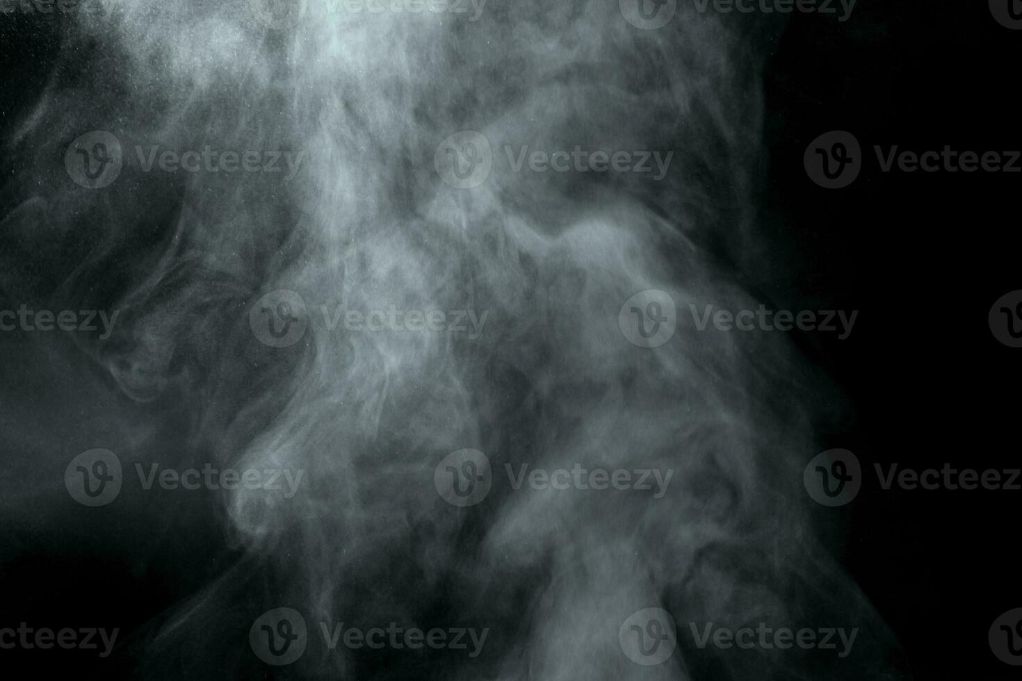 Abstract  powder or smoke isolated on black background photo