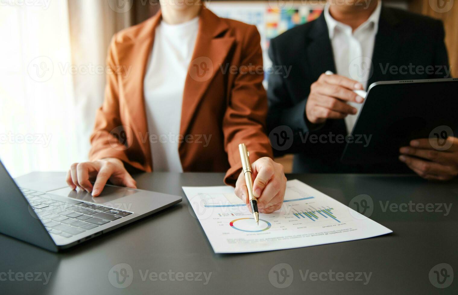 Business documents on office table with smart phone and calculator digital tablet and graph photo