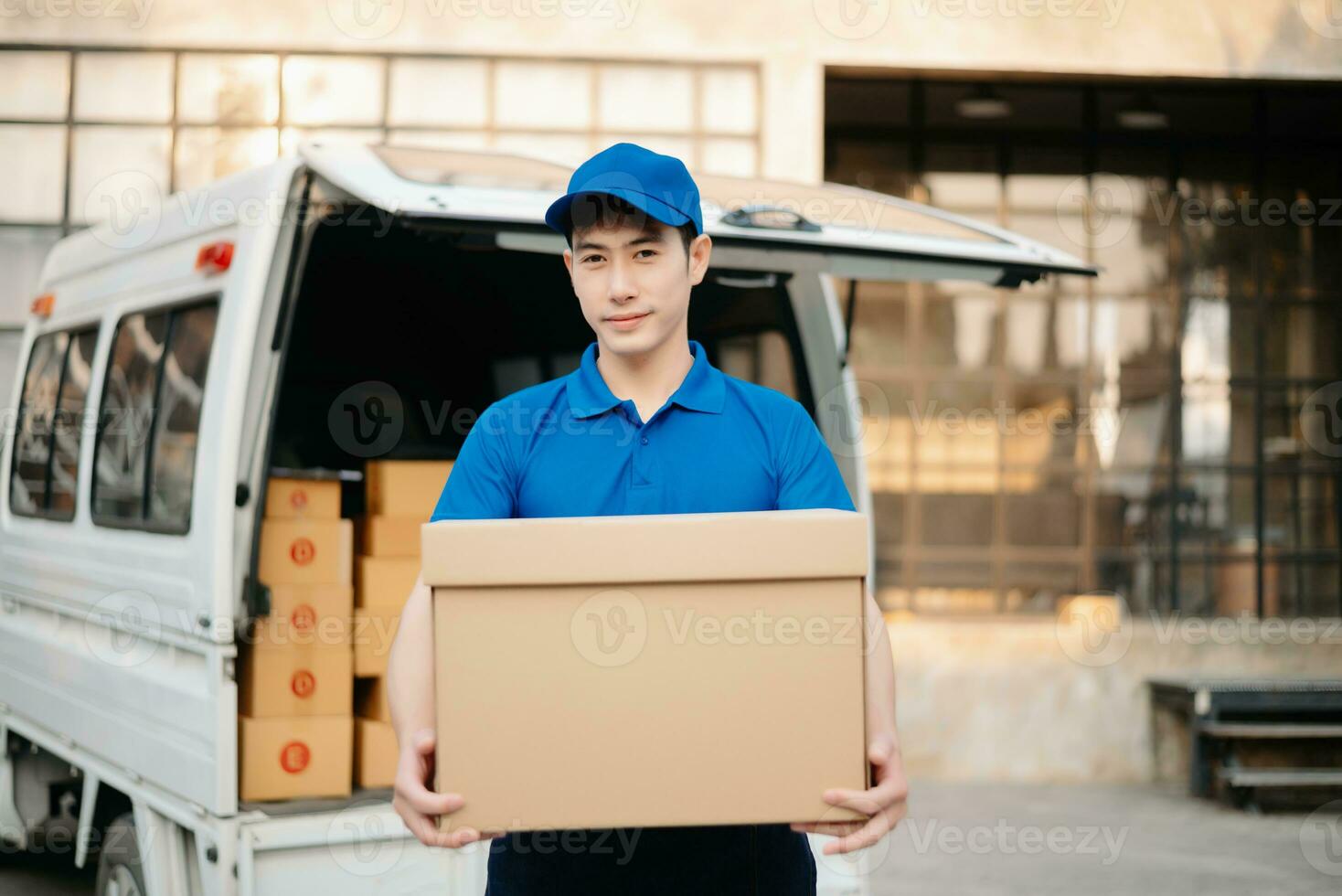 Portrait of courier delivery Asian man searching the address on digital tablet. Delivery service, delivery home and shipping concept. photo