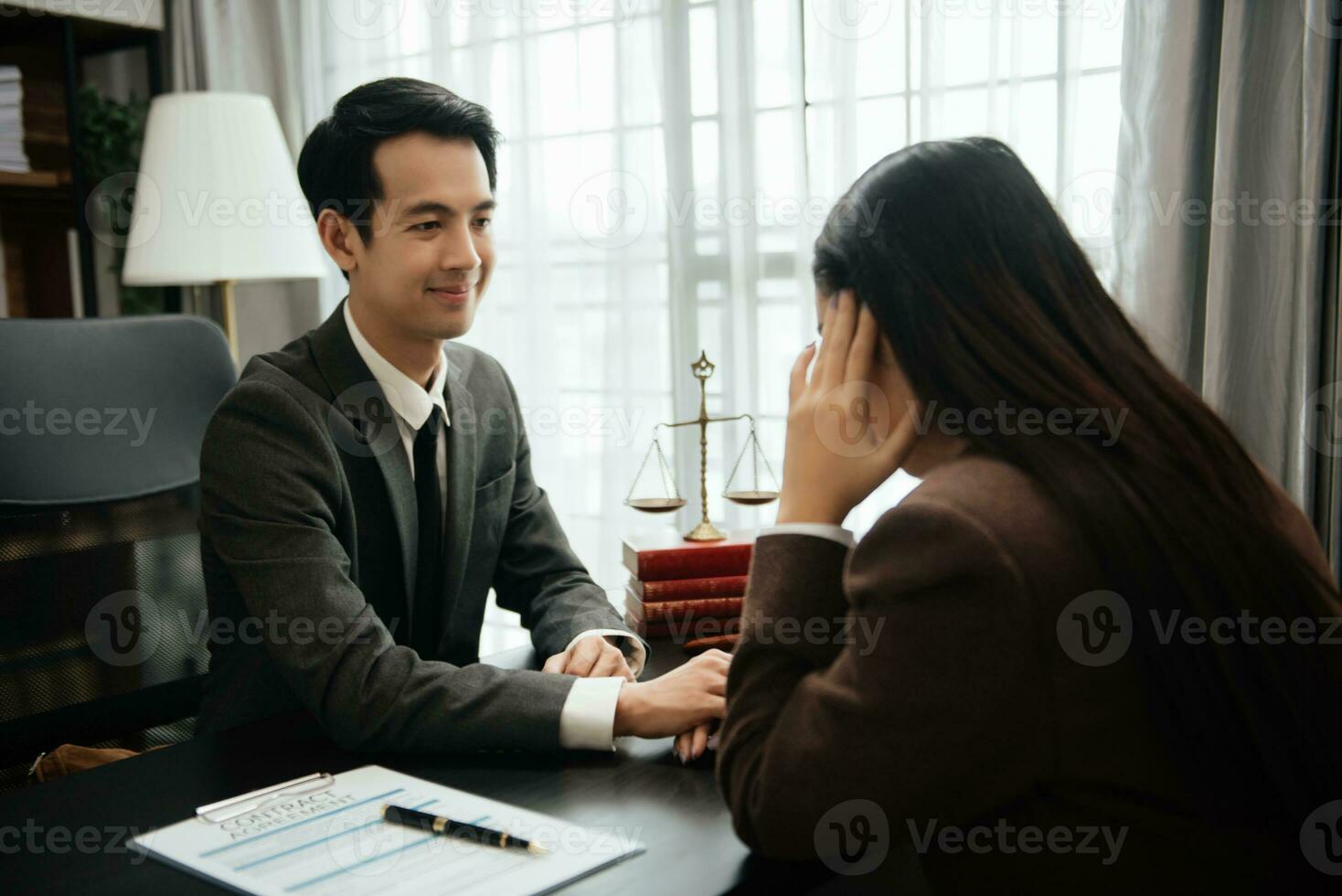 Business law concept, Lawyer business lawyers are consulting lawyers for women entrepreneurs to file copyright lawsuit with laptop and tablet at office photo