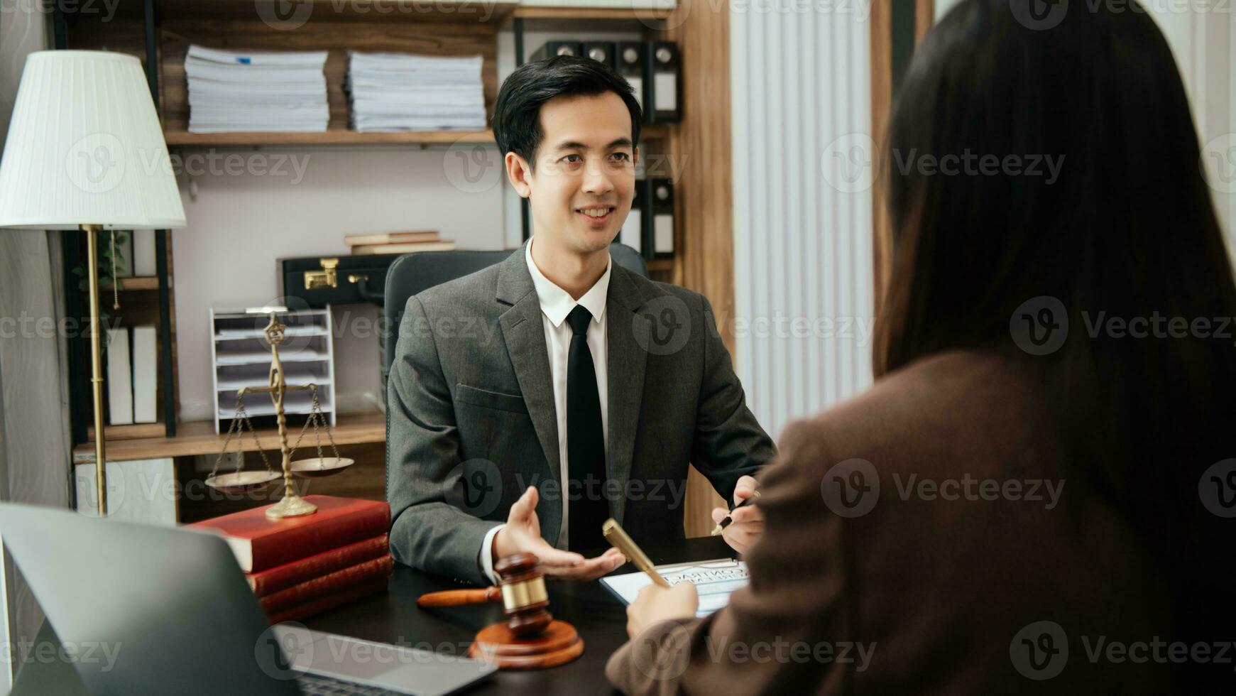 Business law concept, Lawyer business lawyers are consulting lawyers for women entrepreneurs to file copyright lawsuit with laptop and tablet at office photo