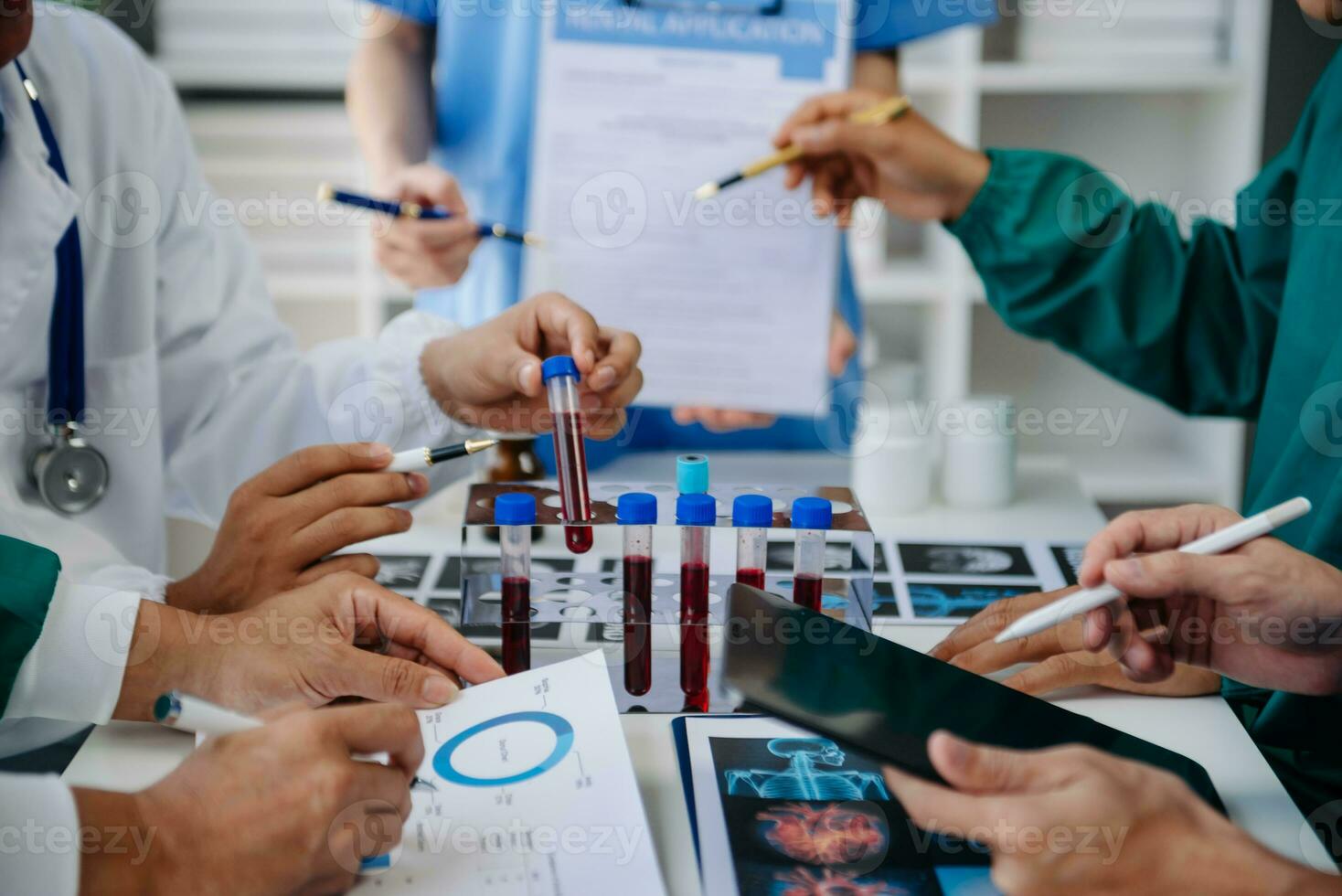 Medical technology network team meeting concept. Doctor hand working with smart phone modern digital tablet and laptop computer with graphics chart interface, with virtual icon diagram photo