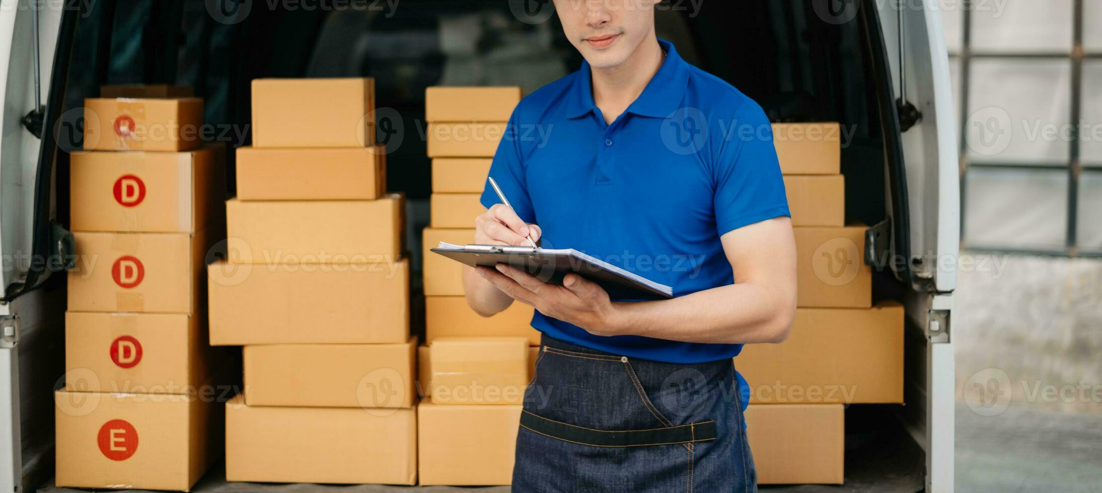 Portrait of courier delivery Asian man searching the address on digital tablet. Delivery service, delivery home and shipping concept. photo