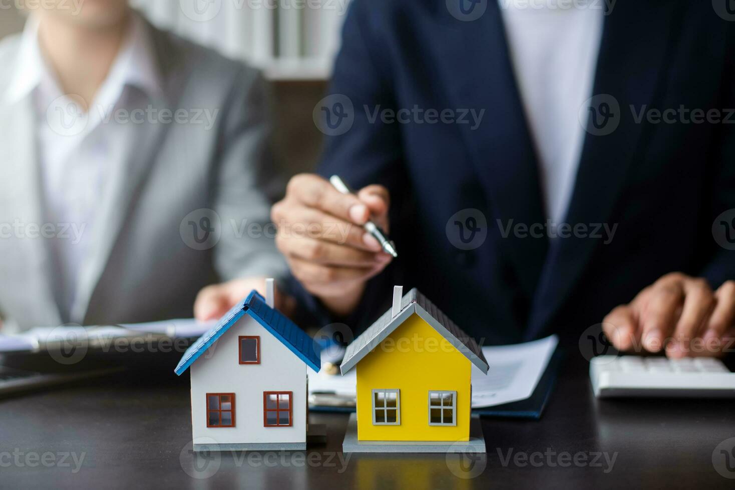 Signing a contract. Client and broker agent, lease agreement, successful deal and  Young business sitting at the desk in office photo