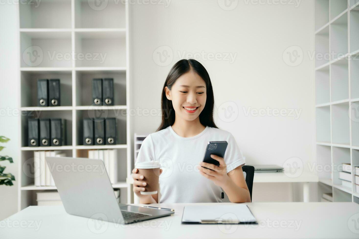 Business woman using tablet and laptop for doing math finance on an office desk, tax, report, accounting, statistics, and analytical research concept in office photo