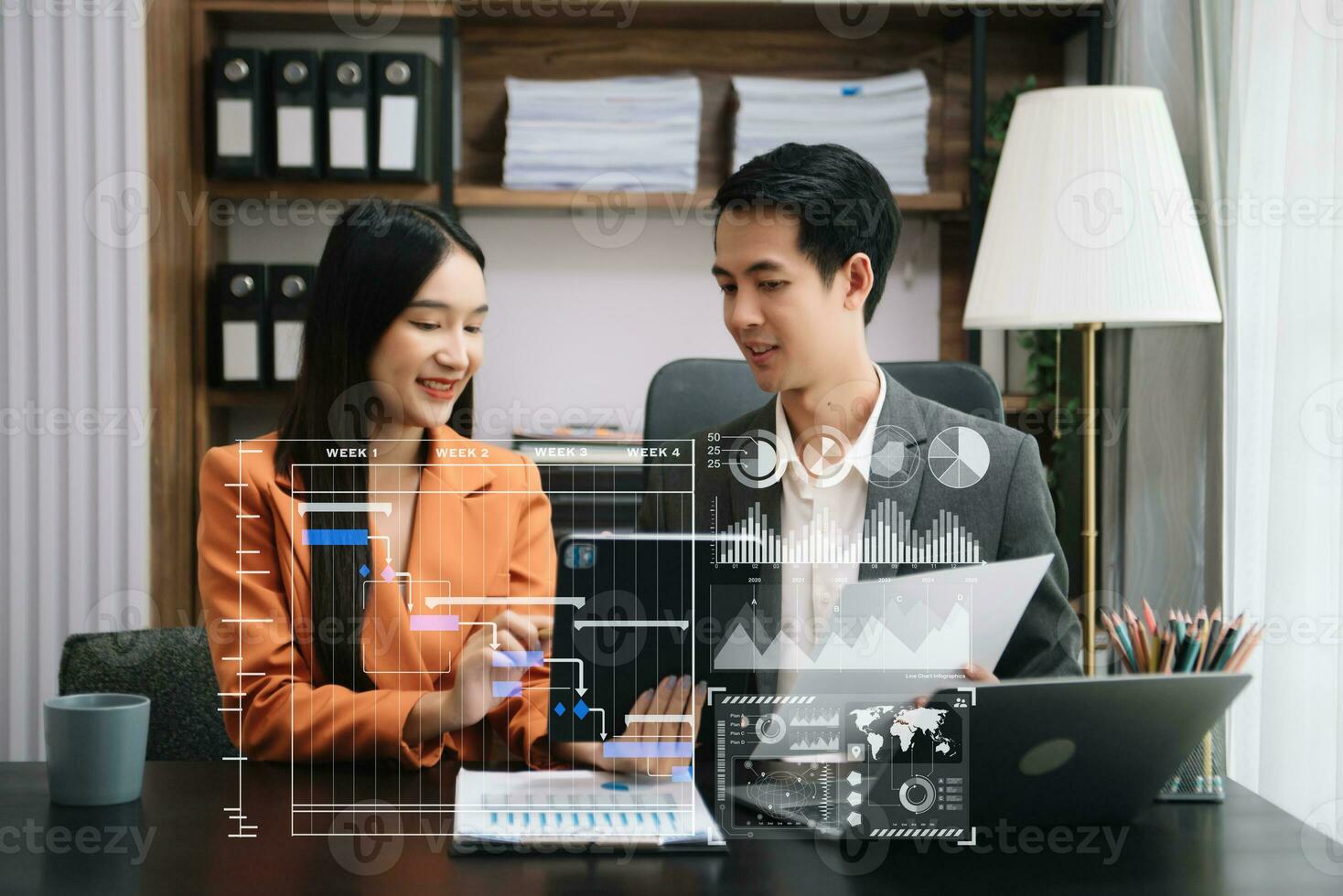 Business team hand Project manager working and update tasks and Gantt chart scheduling virtual diagram.with smart phone, tablet and laptop in office. photo