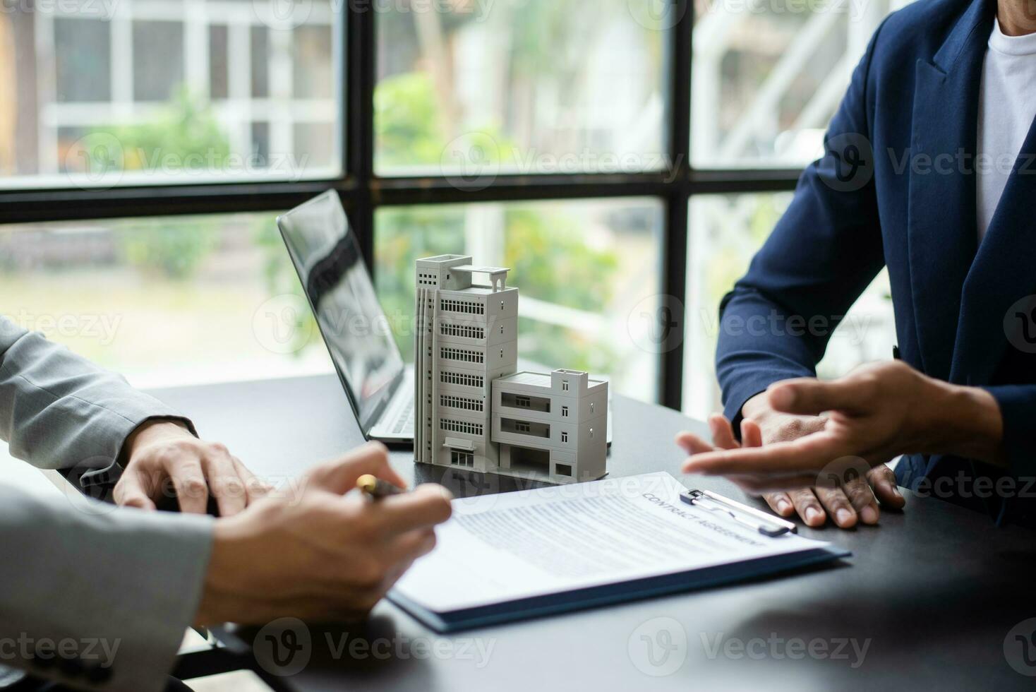 Sales giving male customer signing sales contract, Asian woman and man doing business in office, business concept and contract signing. photo