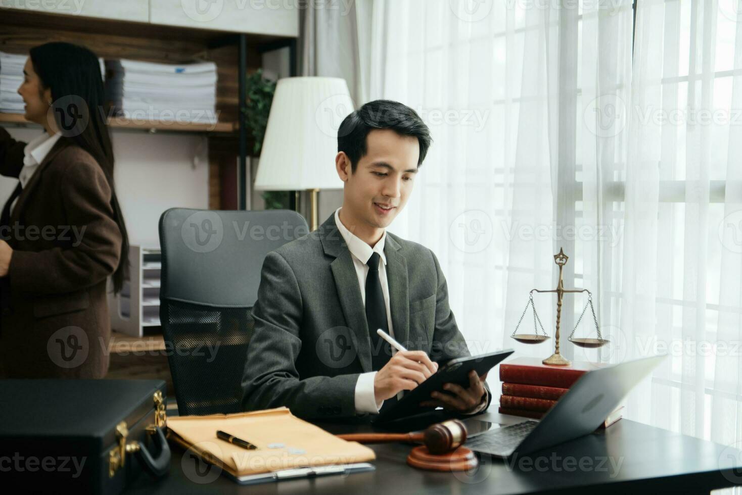 Business Asian people and lawyers discussing contract papers sitting at the table. Concepts of law, advice, legal services. photo