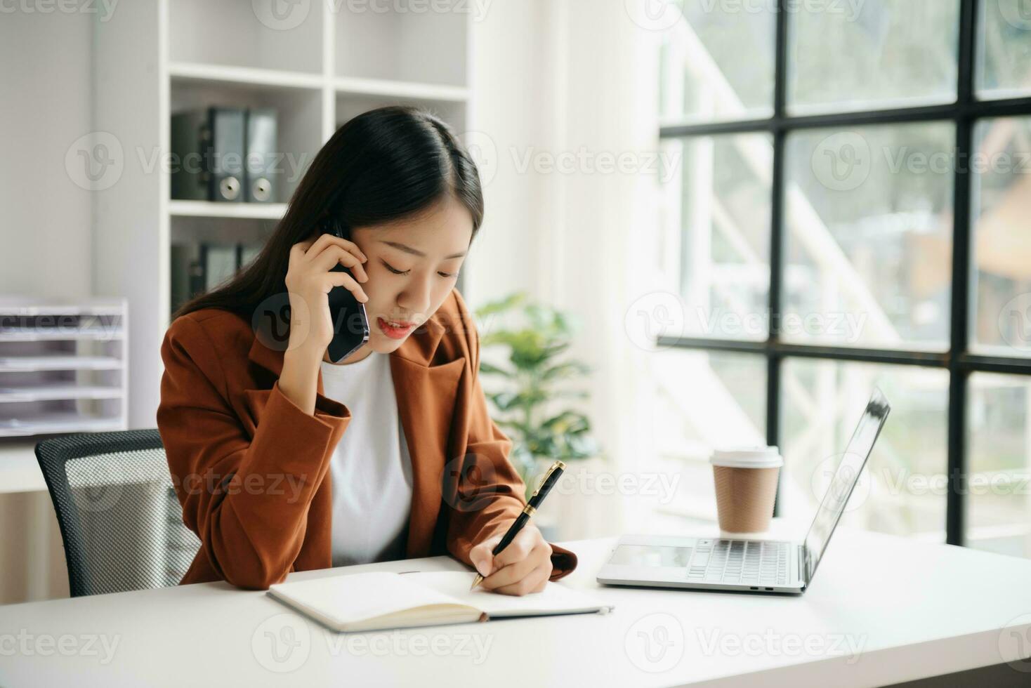 Business woman using tablet and laptop for doing math finance on an office desk, tax, report, accounting, statistics, and analytical research concept in office photo