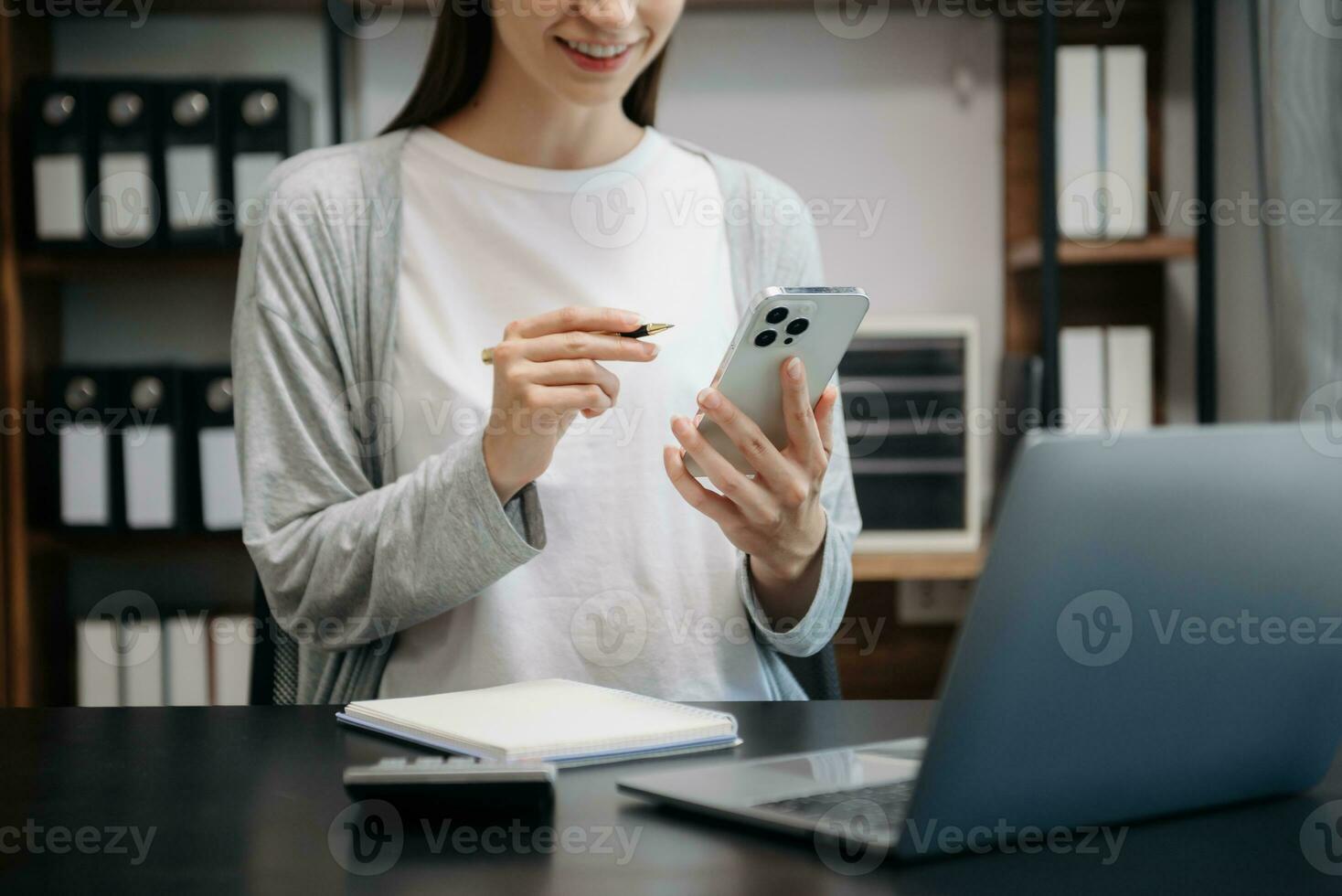 Businesswoman hand using laptop, tablet and smartphone in office. Digital marketing media mobile app and discussing plan new start up project. photo