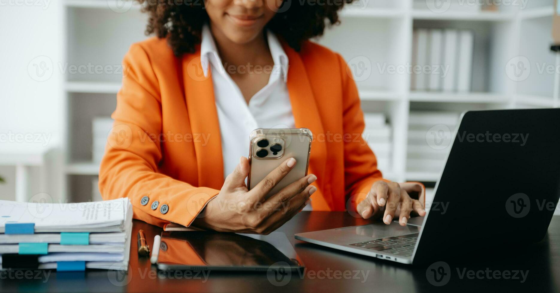Businesswoman hand using laptop, tablet and smartphone in office. Digital marketing media mobile app and discussing plan new start up project. Finance task. photo