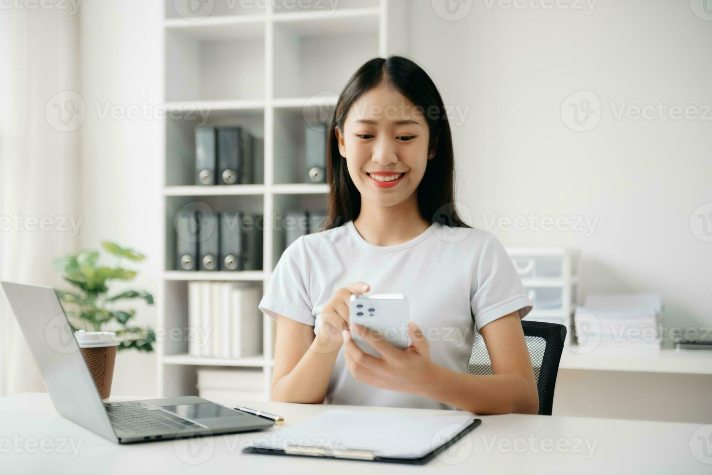 Business woman using tablet and laptop for doing math finance on an office desk, tax, report, accounting, statistics, and analytical research concept in office photo