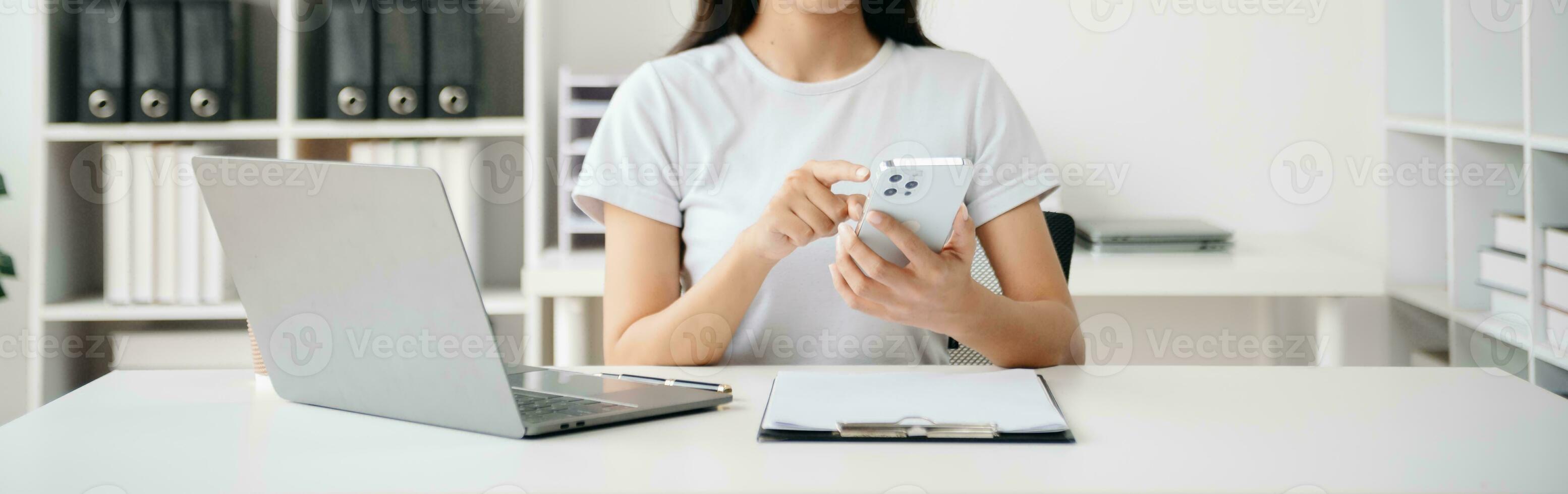Working Process in Modern Office. Young Woman Account Manager Working at Table with New Business Project. ,Using Contemporary Laptop. photo