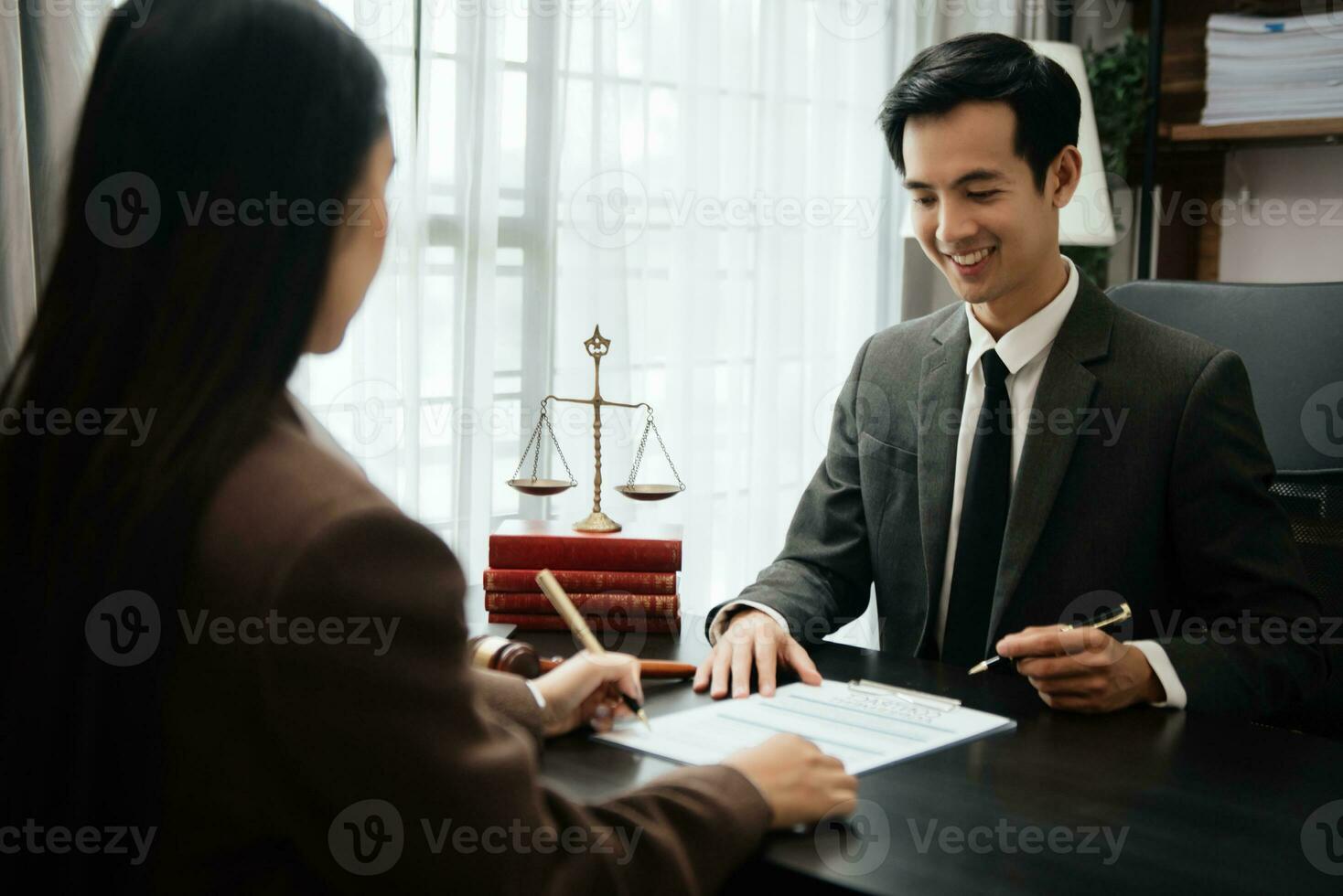 Business law concept, Lawyer business lawyers are consulting lawyers for women entrepreneurs to file copyright lawsuit with laptop and tablet at office photo