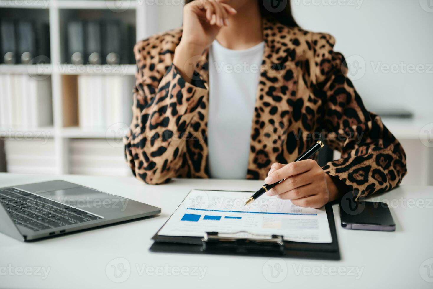 Working Process in Modern Office. Young Woman Account Manager Working at Table with New Business Project. ,Using Contemporary Laptop. photo