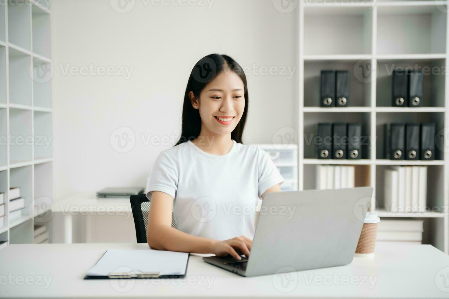 Business woman using tablet and laptop for doing math finance on an office desk, tax, report, accounting, statistics, and analytical research concept in office photo