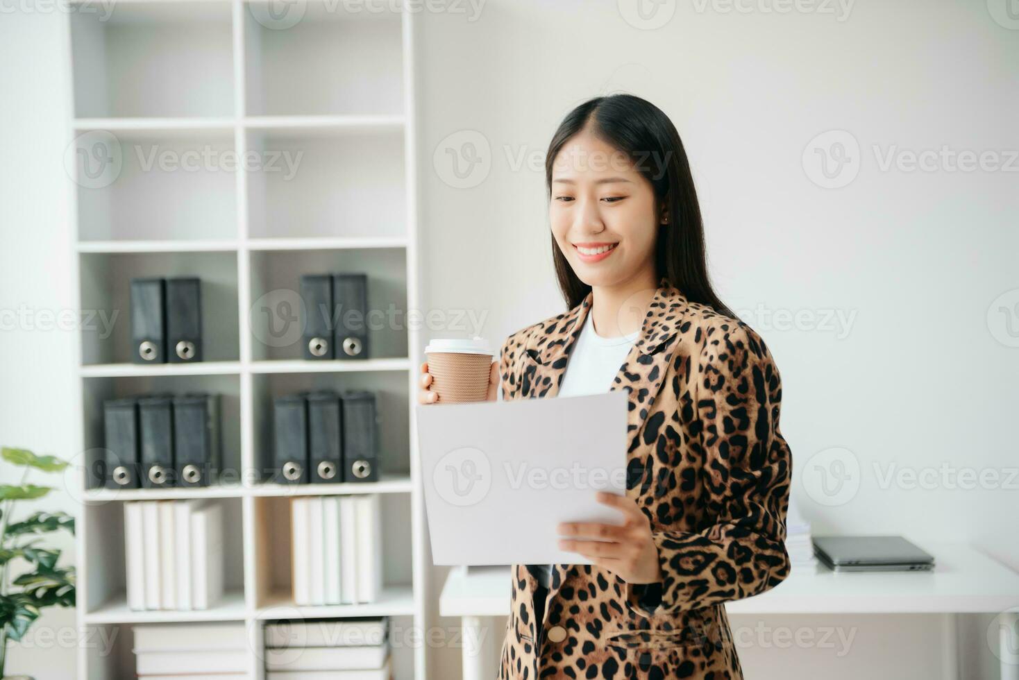 Business woman using tablet and laptop for doing math finance on an office desk, tax, report, accounting, statistics, and analytical research concept in office photo