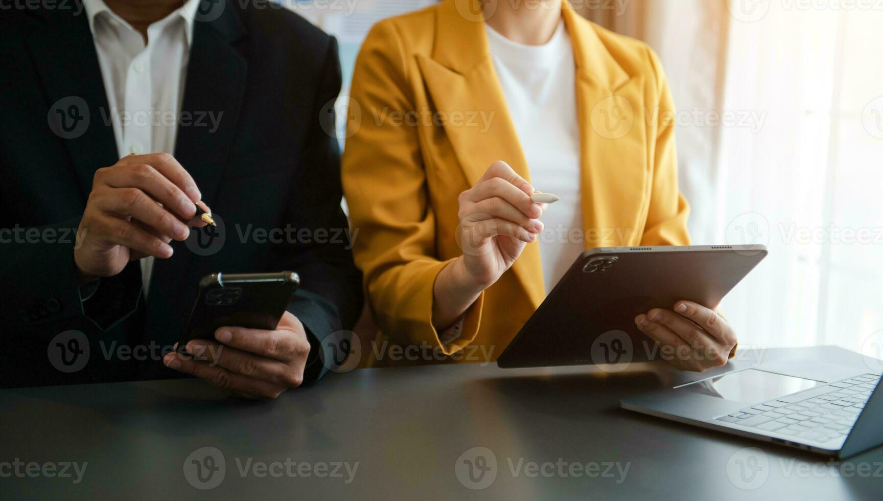 Business documents on office table with smart phone and calculator digital tablet and graph photo