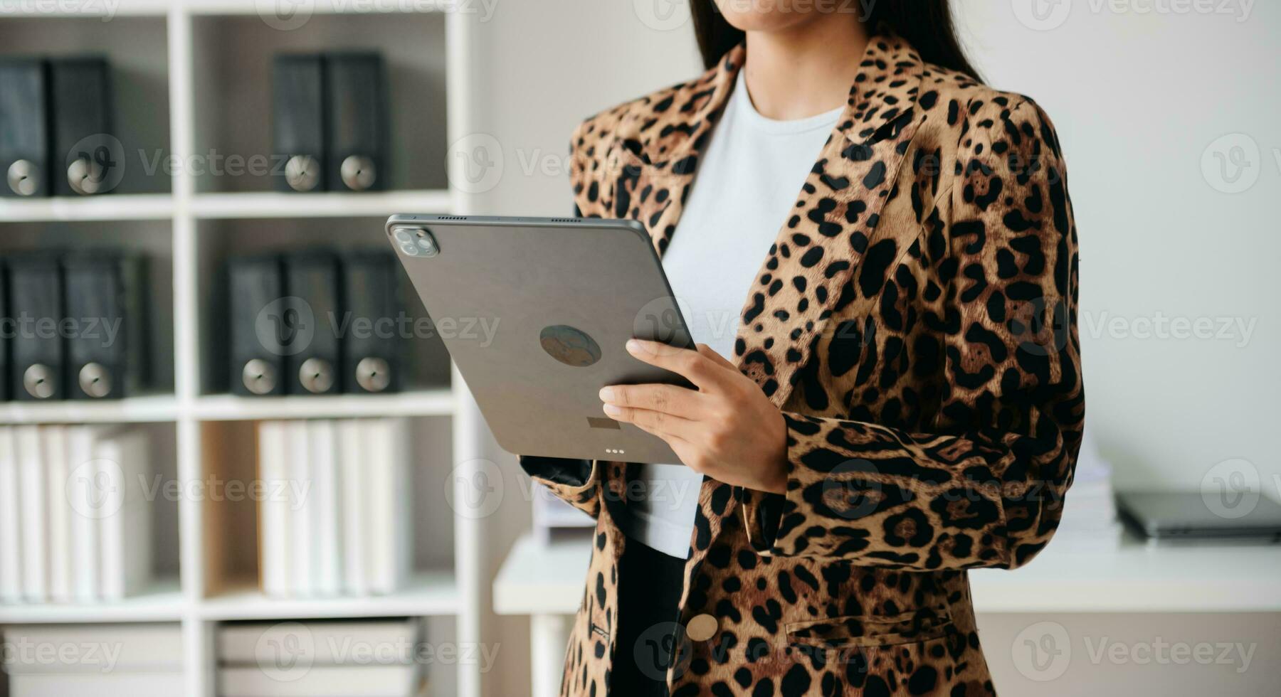 Working Process in Modern Office. Young Woman Account Manager Working at Table with New Business Project. ,Using Contemporary Laptop. photo