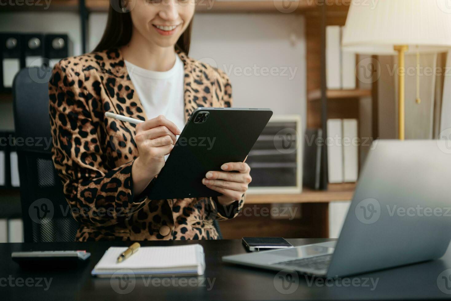 Businesswoman hand using laptop, tablet and smartphone in office. Digital marketing media mobile app and discussing plan new start up project. photo
