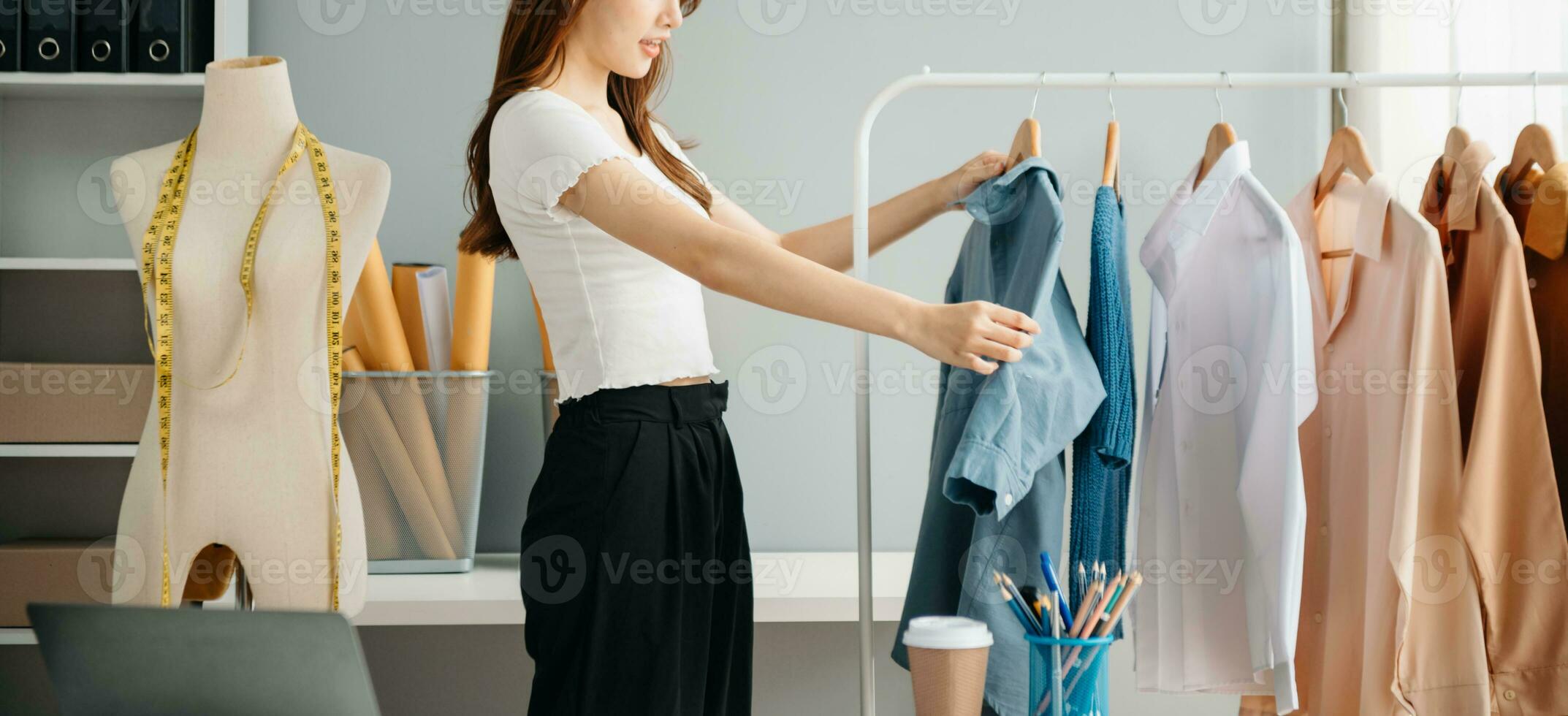 Young woman running online store Startup small business SME, using smartphone or tablet receive and checking online purchase shopping order photo