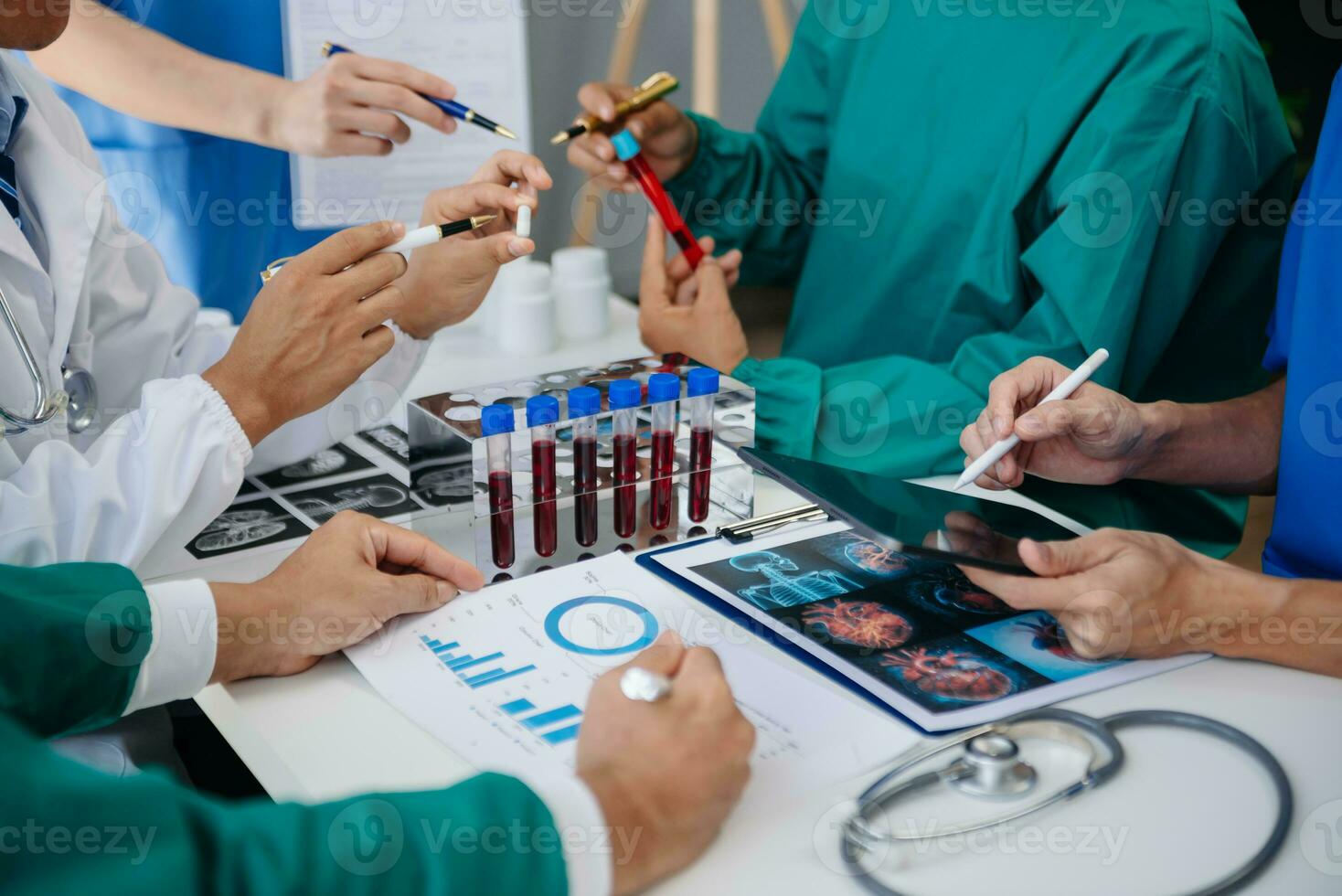 Medical technology network team meeting concept. Doctor hand working with smart phone modern digital tablet and laptop computer with graphics chart interface, with virtual icon diagram photo