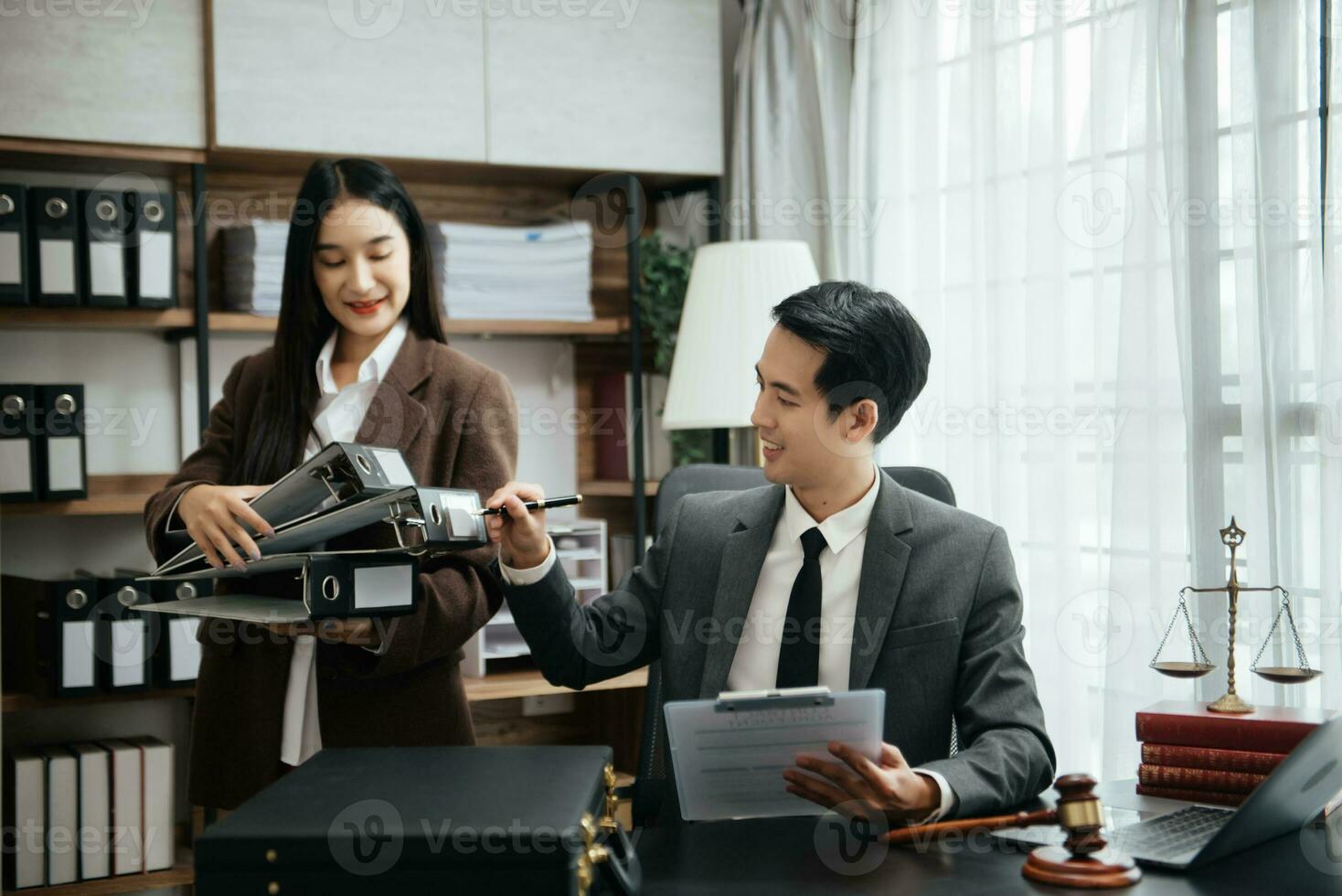 Business Asian people and lawyers discussing contract papers sitting at the table. Concepts of law, advice, legal services. photo