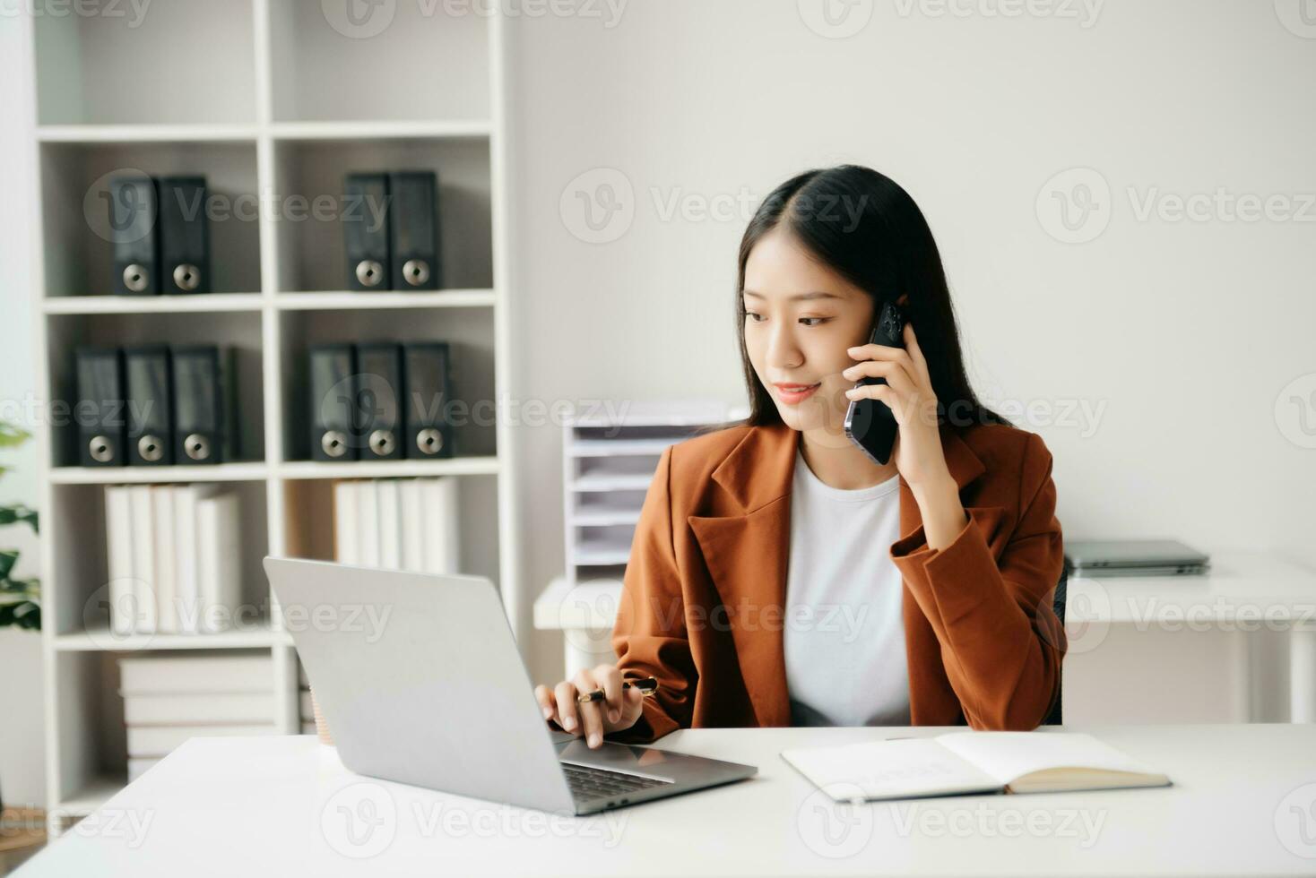 Business woman using tablet and laptop for doing math finance on an office desk, tax, report, accounting, statistics, and analytical research concept in office photo