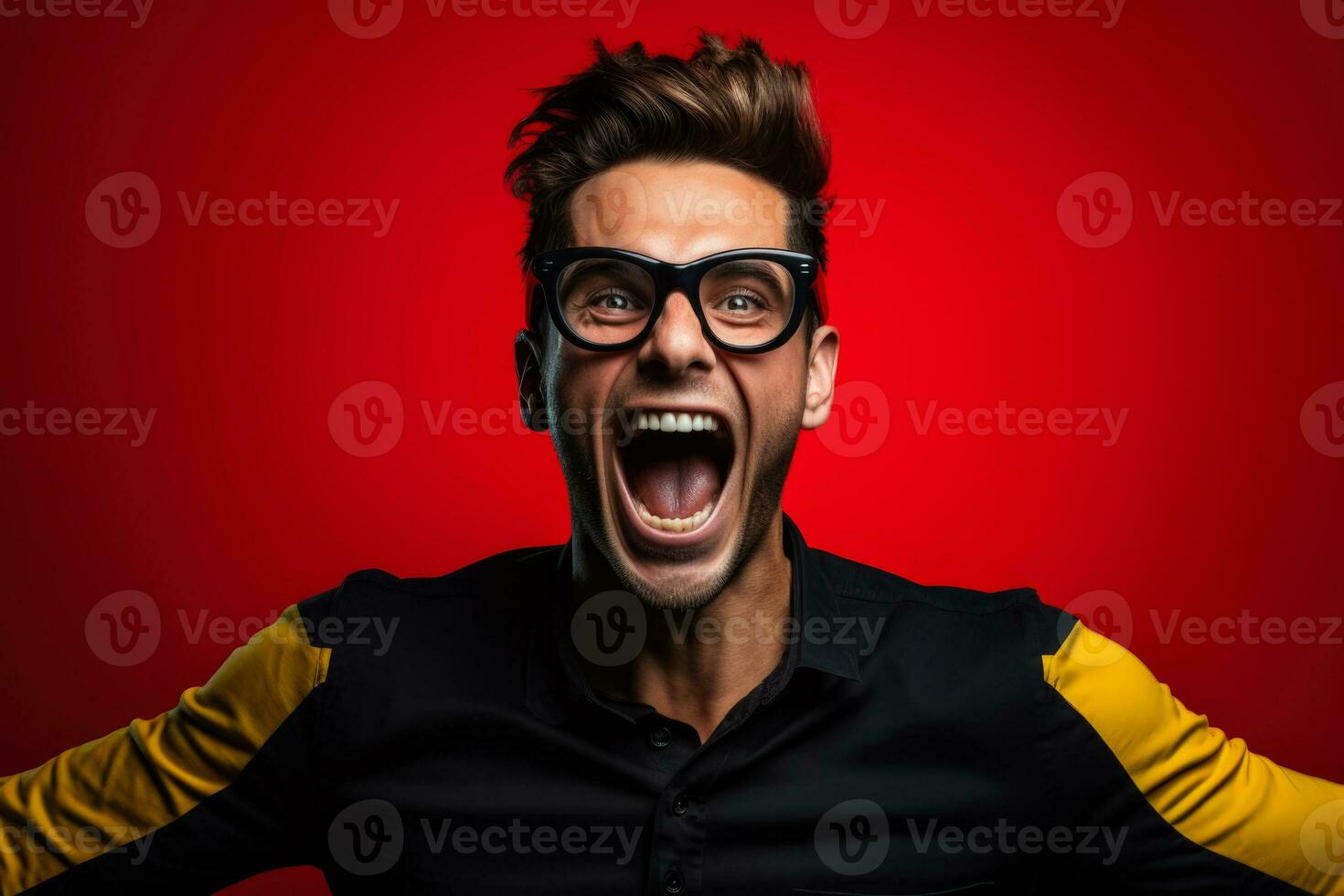 Belgian football fan celebrating a victory on black yellow and red background with empty space for text photo