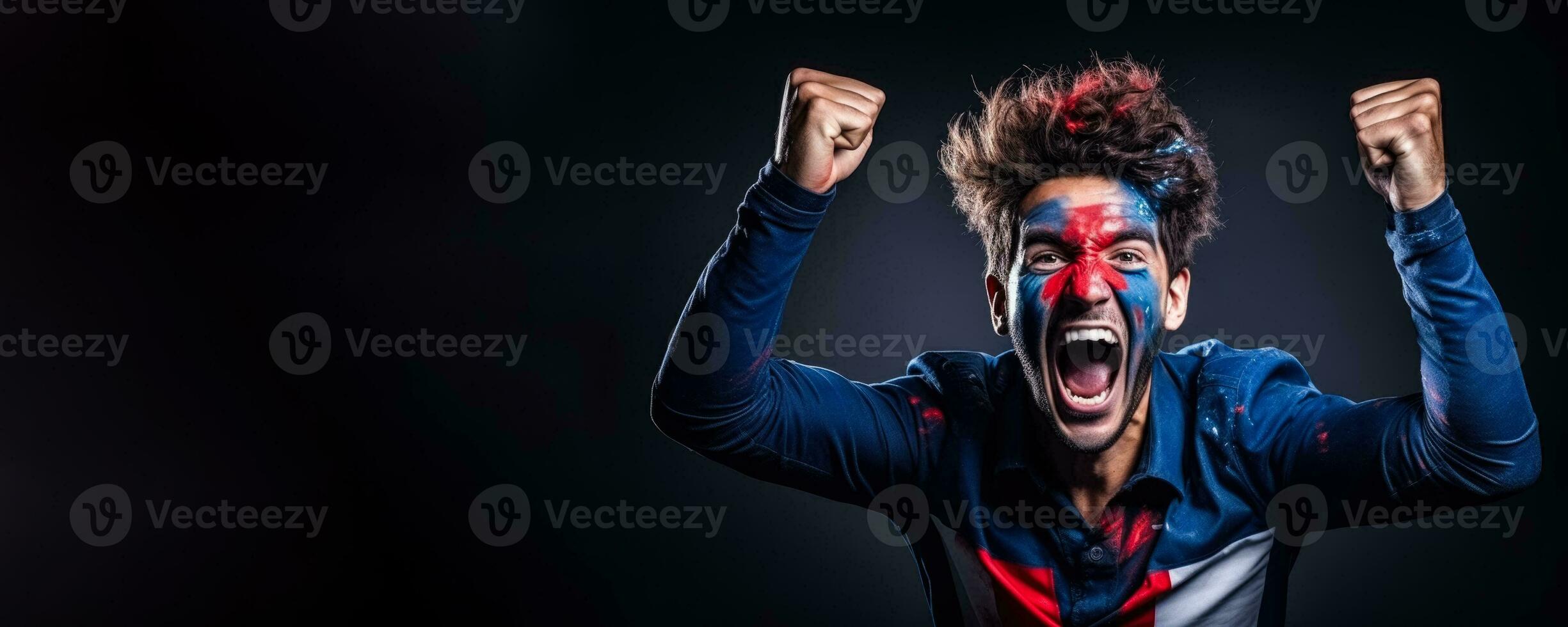 French football fan celebrating a victory on blue background with empty space for text photo