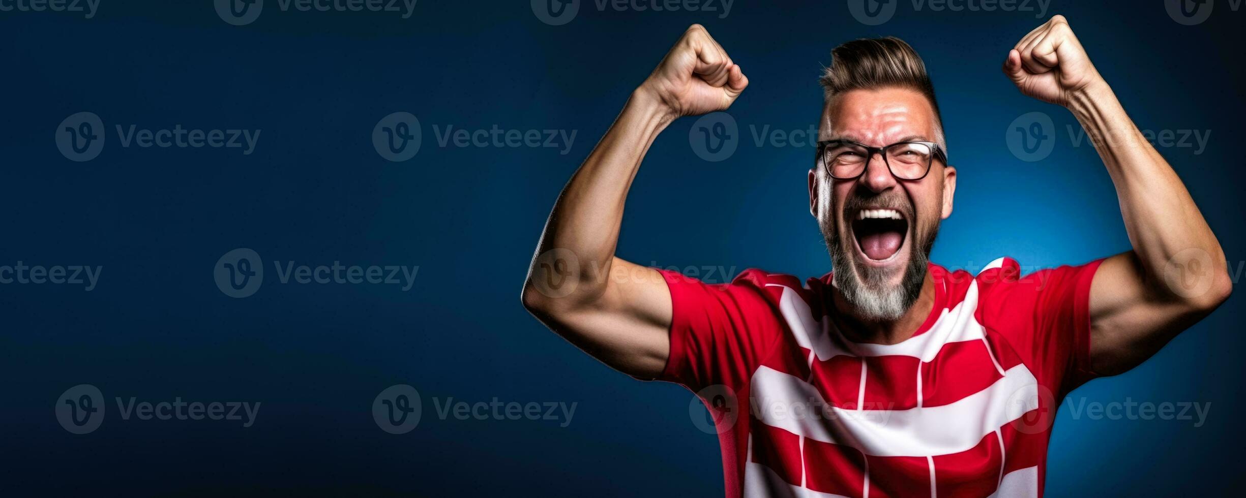 Croatian football fan celebrating a victory on red and white background with empty space for text photo