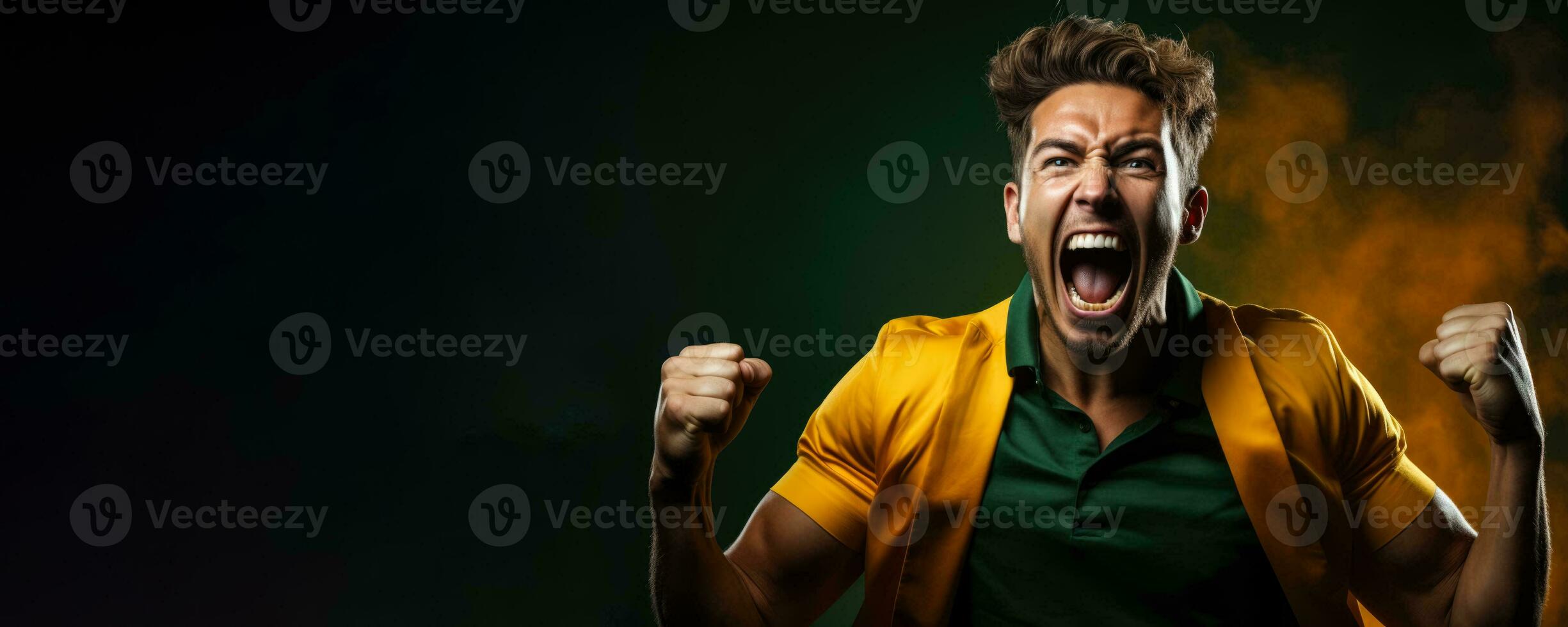 Australian football fan celebrating a victory on green and gold background with empty space for text photo