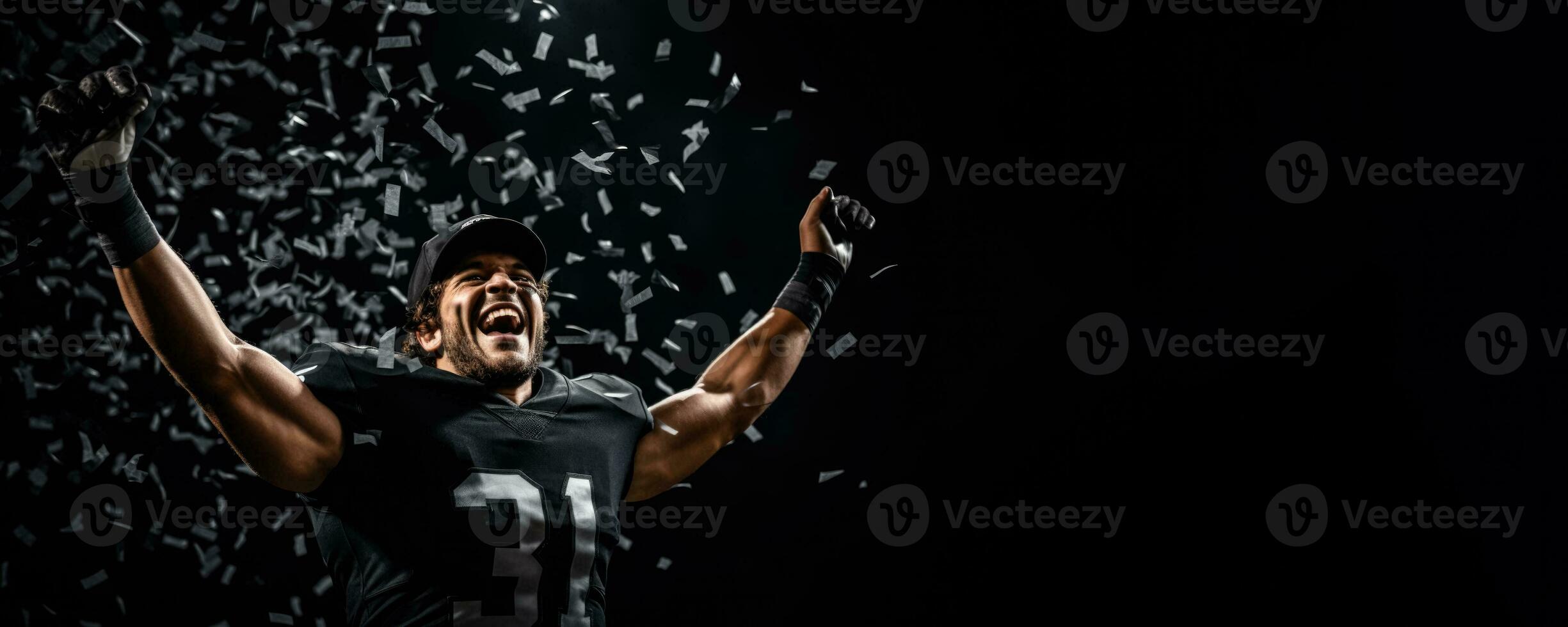 American football player celebrating a championship win on black background with empty space for text photo