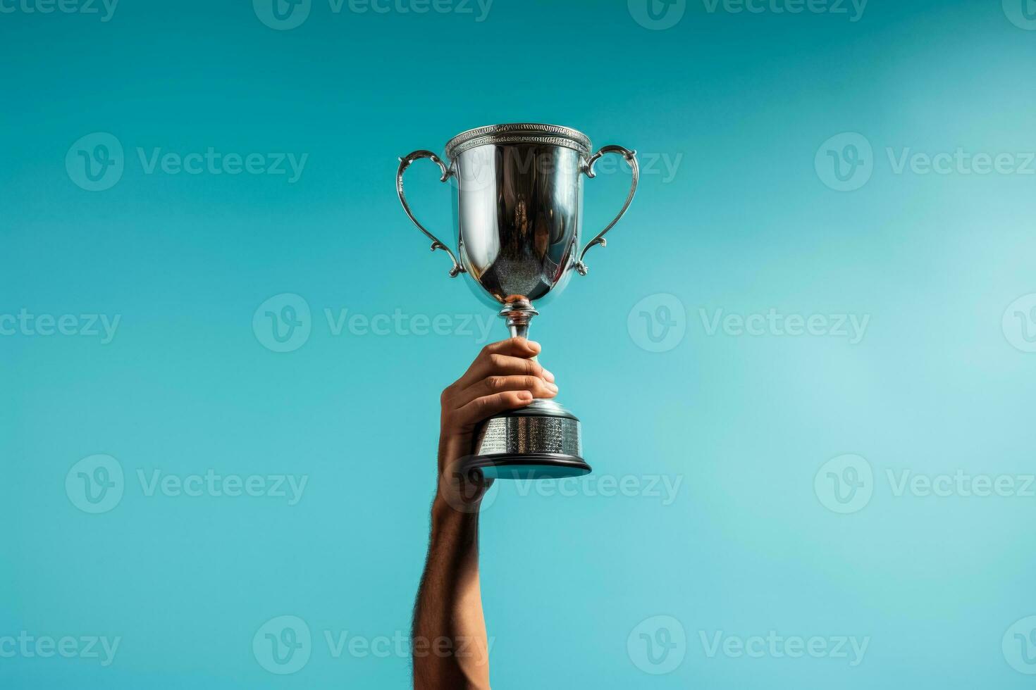 Golfer raising the championship trophy after a hard-fought win on blue background with empty space for text photo