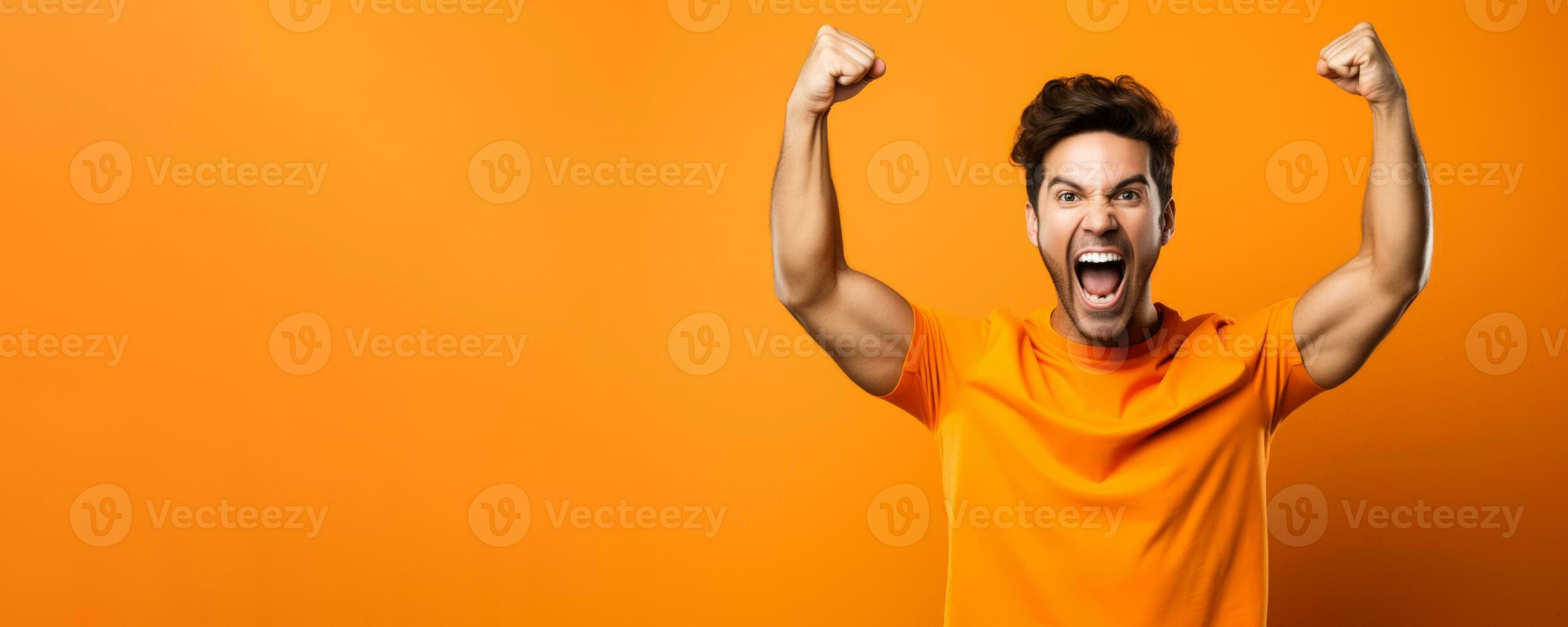 American football fan celebrating a victory on orange background with empty space for text photo