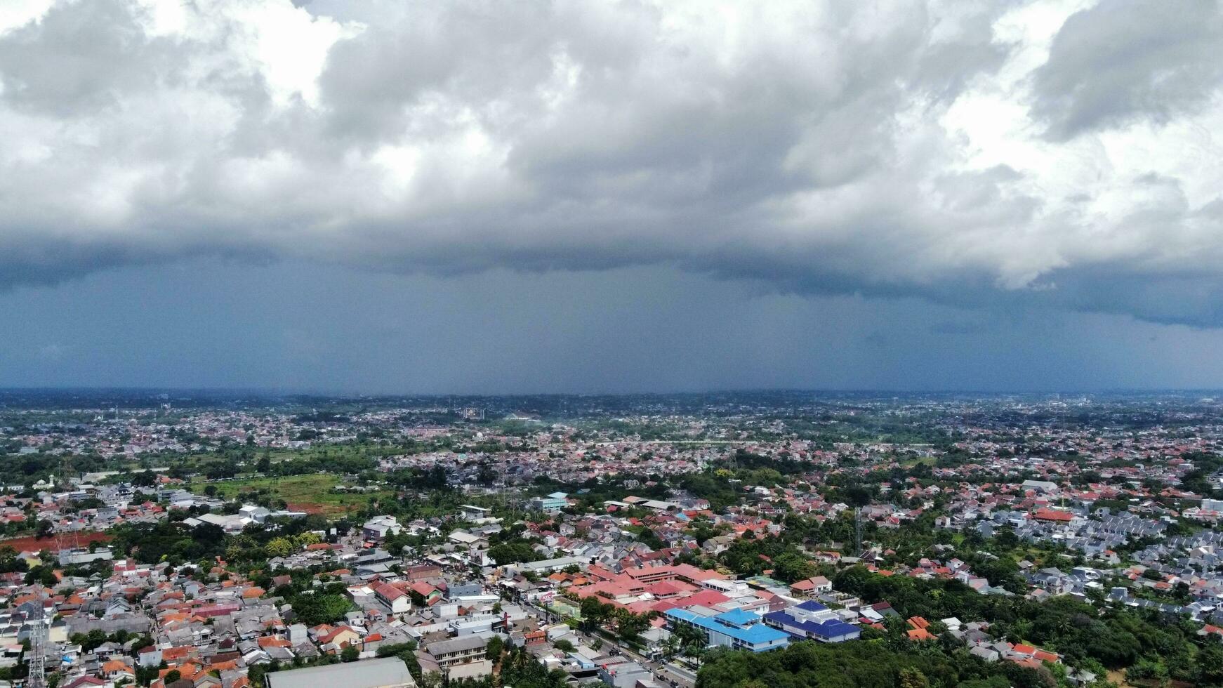 black clouds over the city sky photo