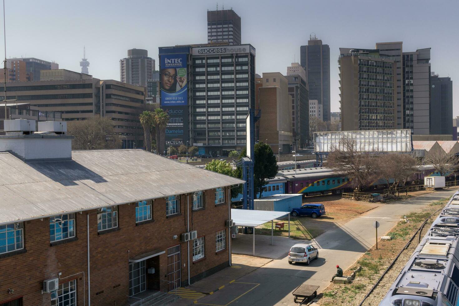Johannesburg, South Africa, August 13 2018 The Central Park Train Station in Downtown Johannesburg with the city skyline in the background photo