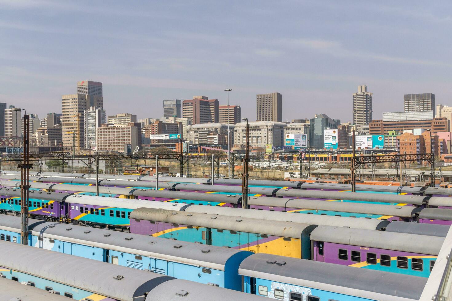 Johannesburg, South Africa, August 13 2018 The Central Park Train Station in Downtown Johannesburg with the city skyline in the background photo